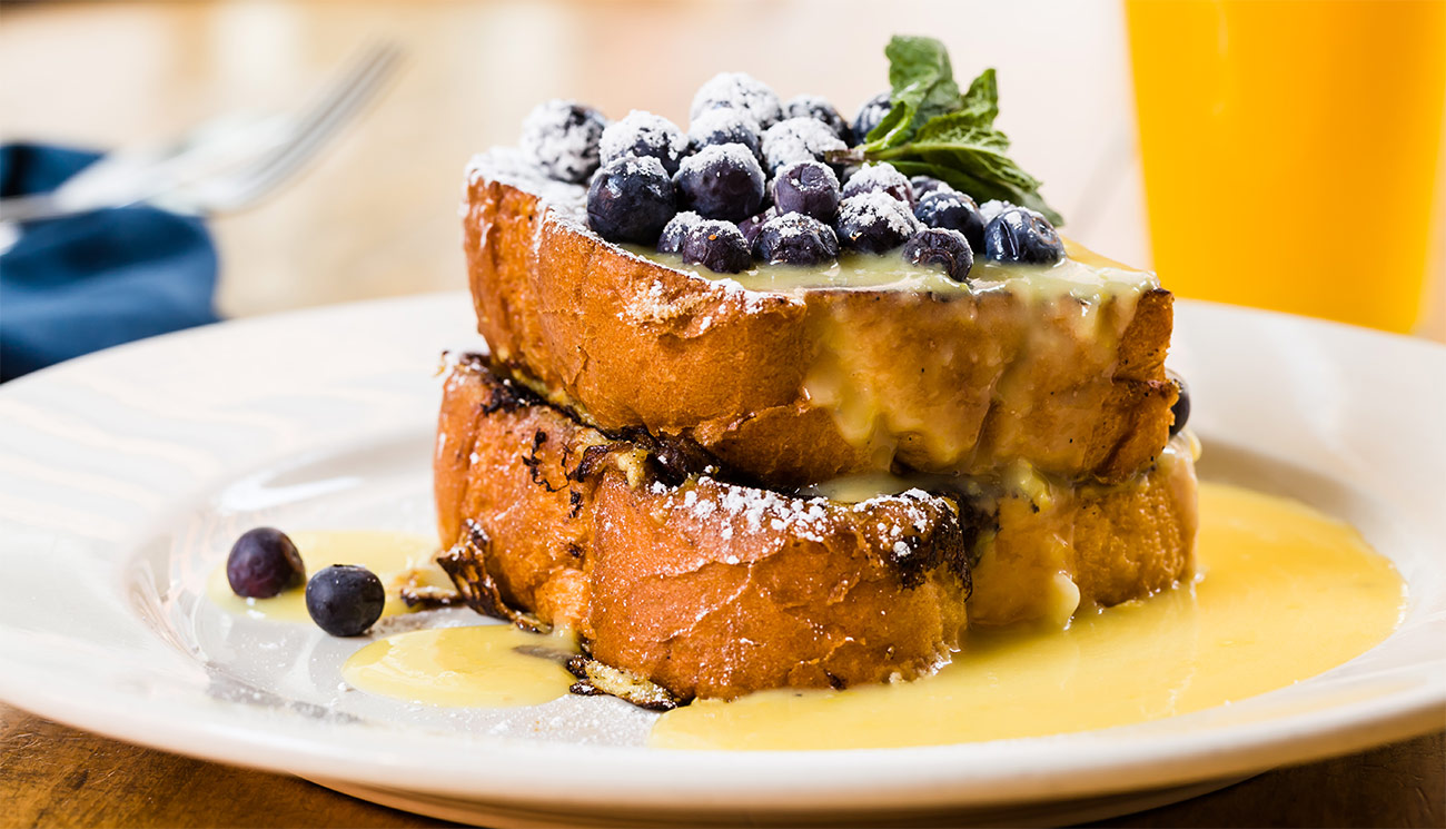 Tess' toast - whipped butter, lemon curd, fresh berries, powdered sugar.